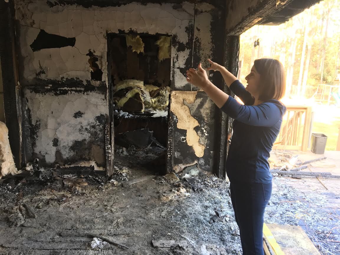 Amy Fields inside burned home